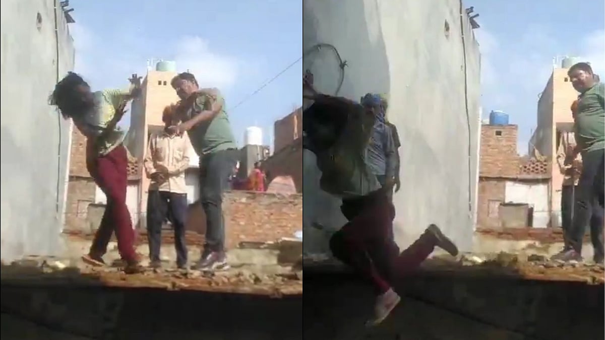 Man slaps woman who falls off a roof in Delhi - X
